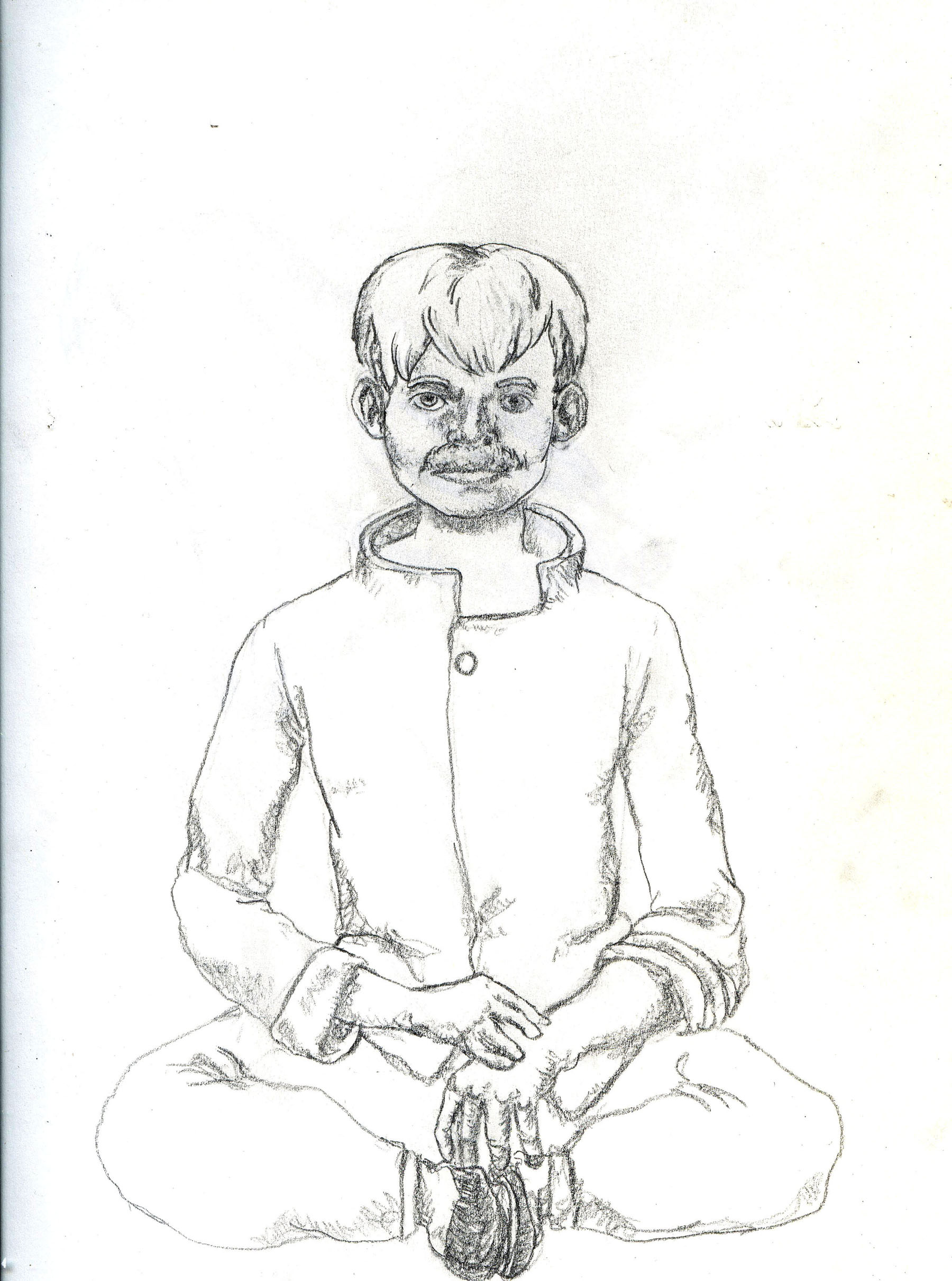a seated man meditating
